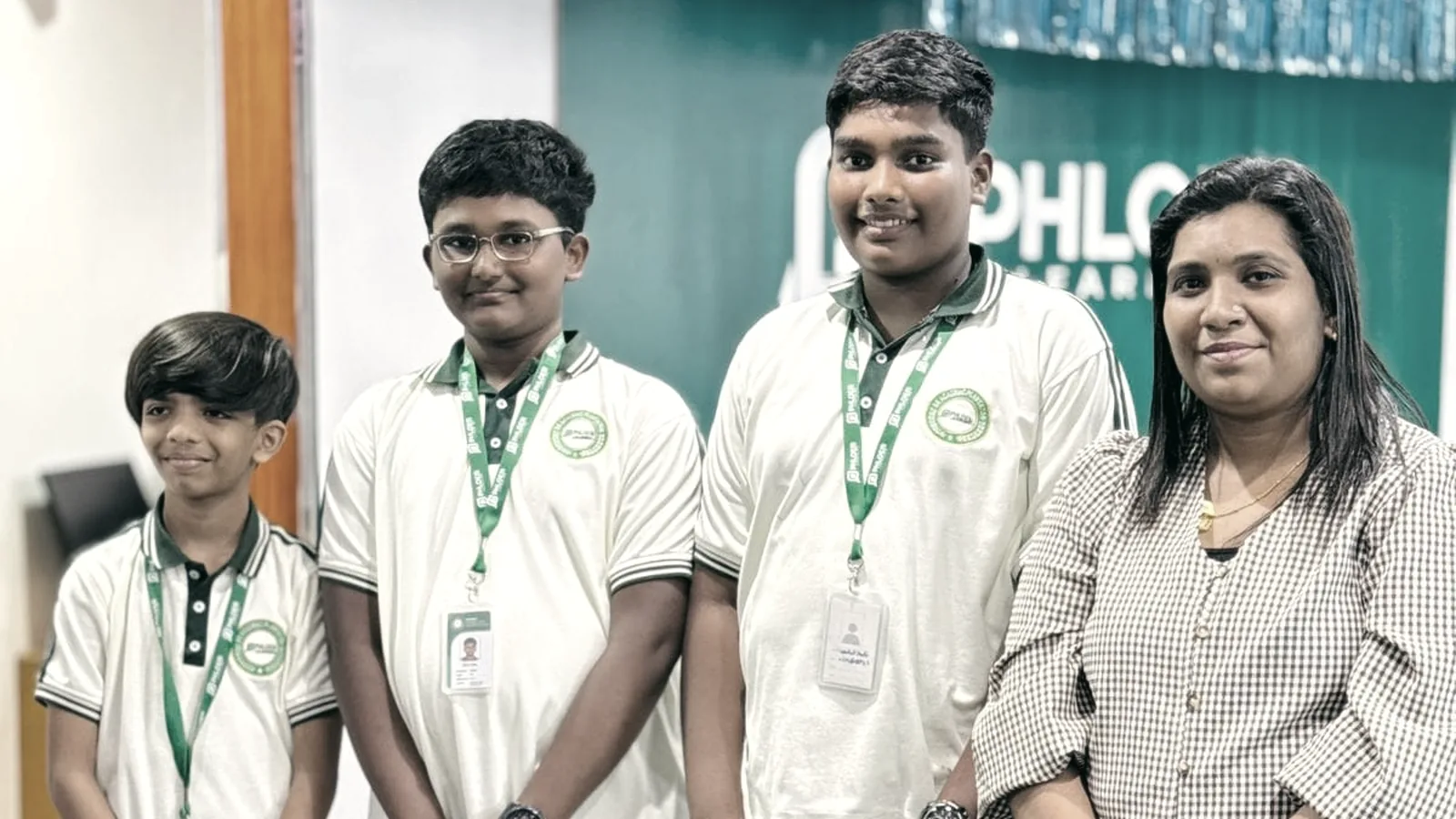 Three students with their tutor at PHLOEM Learning in Abu Dhabi